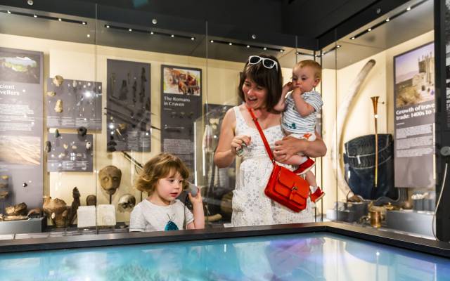 Skipton Town Hall_204 Mother with two children using an interactive display in the museum